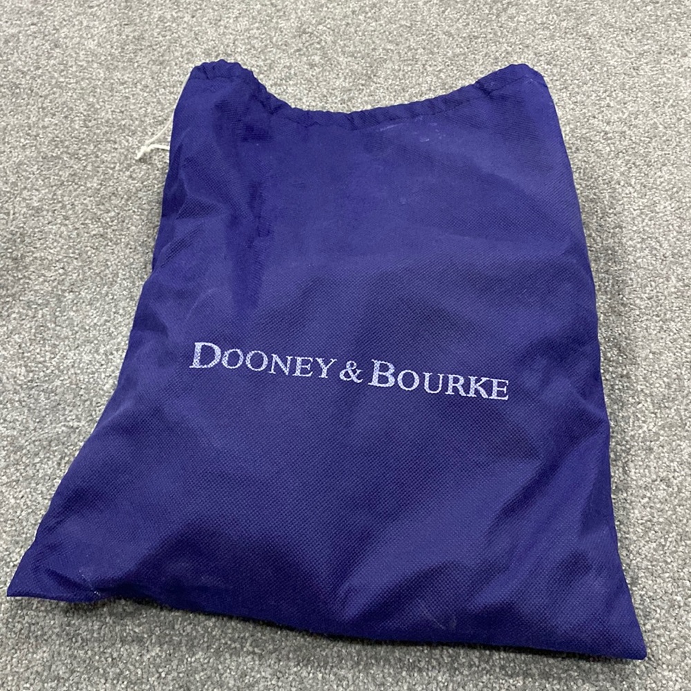 Dooney & Bourke, Brown T’moro color purse, brand new never used